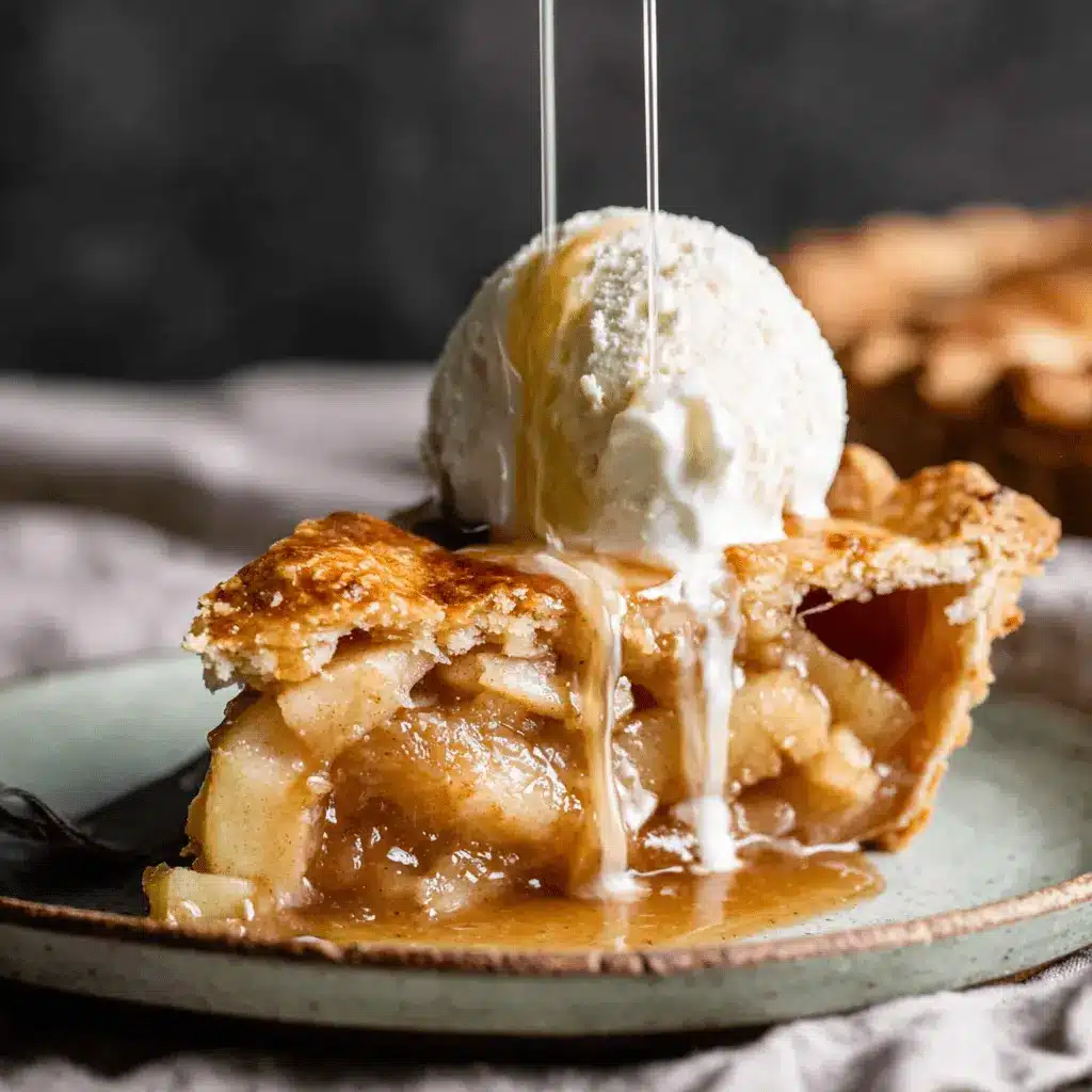 The Ultimate Foolproof Apple Pie Recipe 2 Golden-crusted slice of apple pie à la mode with a sweet drizzle, showcasing an irresistible Apple Pie Recipe.