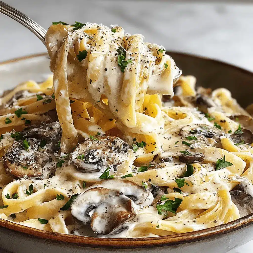 Amazing Creamy Mushroom Pasta in 30 Minutes 2 A fork lifts a serving of creamy mushroom pasta, garnished with fresh herbs and Parmesan, from a rustic bowl.