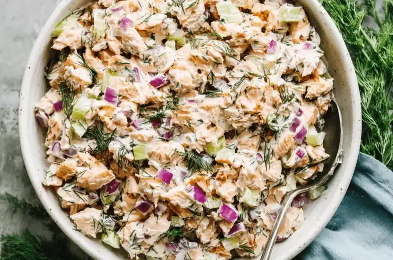 Chunky and creamy salmon salad with fresh dill and red onion, representing classic salmon salad recipes.
