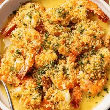 The Ultimate Shrimp Oreganata Recipe: Quick & Flavorful 3 Close-up of baked, breaded shrimp in a white oval dish, illustrating the delicious shrimp oreganata recipe.