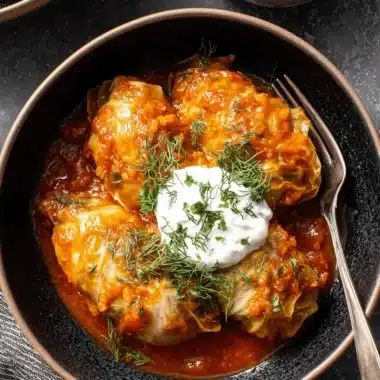 Ultimate Foolproof Cabbage Rolls 3 Hearty plate of three plump cabbage rolls in rich tomato sauce, topped with sour cream and fresh dill.