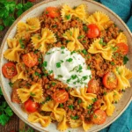 The Ultimate Anna Paul Turkish Pasta 6 Hearty farfalle pasta with seasoned ground meat, cream, and herbs, showcasing the rich flavors of anna paul turkish pasta.
