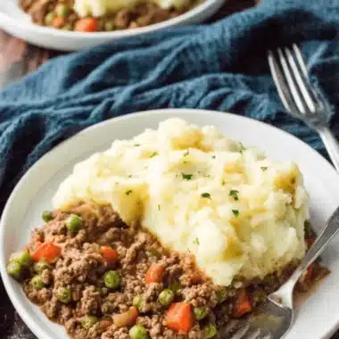 The Ultimate Crockpot Shepherd's Pie Recipe 3 Close-up of a hearty serving of shepherd's pie, showing the creamy mashed potato topping and savory filling, based on a simple crockpot shepherds pie recipe.