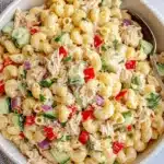 Ultimate Foolproof Tuna Pasta Salad Recipes 5 Close-up of a vibrant elbow macaroni pasta salad with creamy dressing, bell peppers, cucumber, and parsley, ideal for delicious tuna pasta salad recipes.