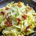 Wonderful Homemade Cabbage Dumplings 5 Hearty pasta dish with wilted cabbage and bacon, evoking the comfort of classic cabbage dumplings.