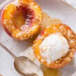 Amazing Baked Peaches: Quick & Easy Dessert 6 Delicious baked peaches with caramelized edges and melting ice cream in a rustic bowl.