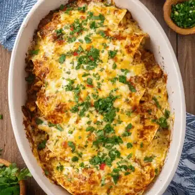 Easy Baked Chicken Tacos: Weeknight Victory! 3 Golden-brown baked enchiladas with melted cheese and fresh cilantro, a flavorful dish that offers a delicious alternative to Baked Chicken Tacos.
