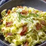 Amazing Cabbage Dumplings: Quick & Easy Recipe 5 Close-up of hearty pasta with tender green cabbage, crispy bacon, and cheese, a satisfying dish for those who enjoy cabbage dumplings.