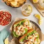 Ultimate Crispy Shrimp PoBoy Sandwich 6 Two vibrant shrimp poboy sandwiches filled with fresh seasoned shrimp, lettuce, and salsa.