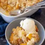 Amazing Peach Cobbler Dump Cake for Busy Nights 5 Mouthwatering peach cobbler dump cake served in a baking dish and a bowl with melting vanilla ice cream.
