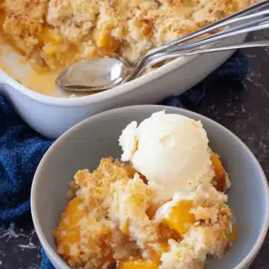 Amazing Peach Cobbler Dump Cake for Busy Nights 3 Mouthwatering peach cobbler dump cake served in a baking dish and a bowl with melting vanilla ice cream.