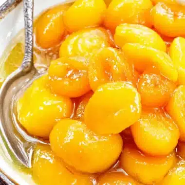 Amazing Fresh Peach Pie Filling Recipes 4 Glistening stewed apricots in a rustic bowl, offering sweet inspiration for peach pie filling recipes.