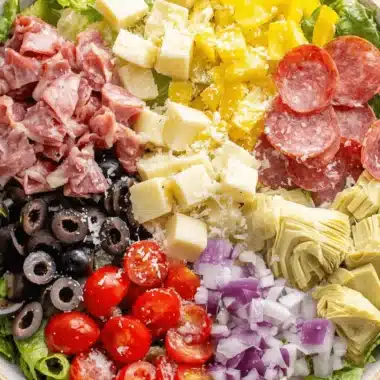 Amazing Antipasto Salad: Quick & Easy Recipe 4 Colorful and fresh antipasto salad with an array of cured meats, cheeses, and crisp vegetables.
