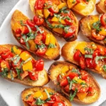 Amazing Cherry Tomato Bruschetta: Quick & Easy 5 Close-up of vibrant cherry tomato bruschetta on toasted baguette with fresh basil, ready to serve.