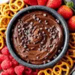 Amazing Chocolate Hummus: Guilt-Free & Easy Treat 8 Creamy chocolate hummus platter with fresh strawberries, raspberries, and pretzels.